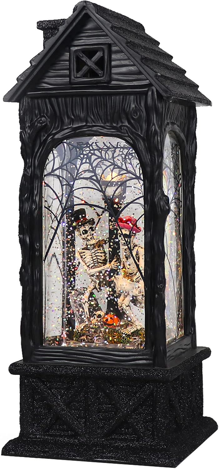 Halloween snow globe lantern with ghost projection and swirling glitter skull design