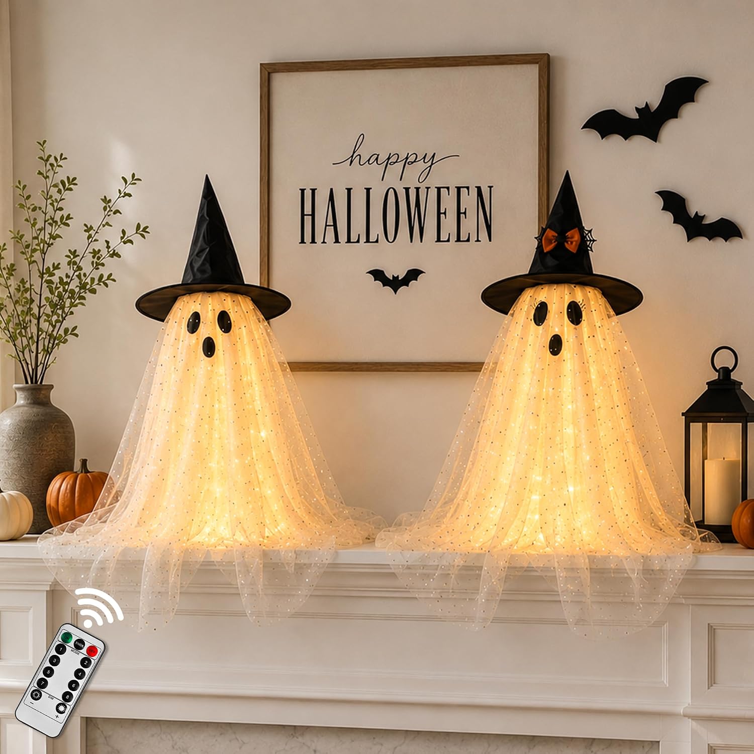 Two lighted Halloween ghost decorations with string lights and remote control for indoor display